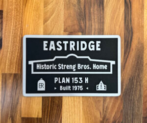 Photo of MCM Historical Home plaque for Eastridge Streng Bros. Plan 153 H